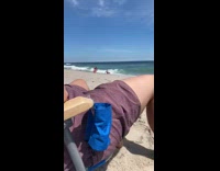 Girl sits gets hit wave pink bikini 