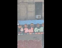 Woman shows multiple deli store on street