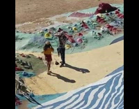Orange shirt red skirt colorful rocks desert
