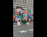 Group of ladies dance by mural for video 