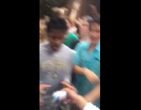 Guy in Vanderbilt shirt does a kegstand and shotguns a beer and tailgate party