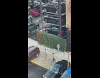 Woman in blue dress models and poses at the parking lot