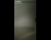 Black beanie red shirt ceiling fan guy