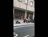 Four women in colored ski mask tiktok dance on the sidewalk