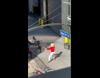 Collab WINY - Man wears bamboo hat meditates on street