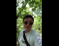 Guy looking for weed in forest woods 