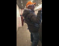 Orange hat older guy says pizza dog 