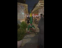 Man in green elf costume tells little girl he is an elf