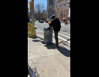 Man Ties Shoes with Blue Boxing Gloves On