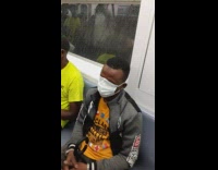 Man with white mask over entire face