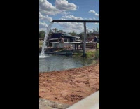 Woman in white bikini on the tub near the irrigation