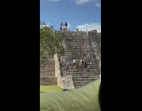 Couple dances on top of the Mayan Pyramid