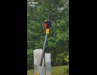 Guy questions leaning street light 