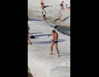 Man blue brief swing body stretch  beach