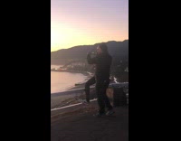 Man jacket crossed arms lift foot pictorial