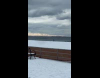 Man ski on the snowy beach seaside