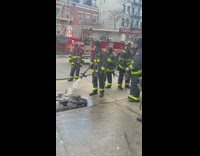 firefighters putting water on bike that was on fire