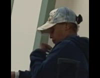 Lady drinks hot sauce bottle blue sweater