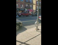 Man on unicycle with three stacked wheels