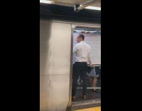 Man brings large rolling whiteboard onto subway train, Eastern Pkwy