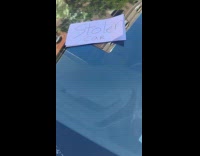 Stolen car note on white car windshield