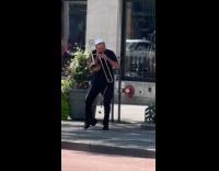 Collab WINY - Man white cap play trombone and stomp 