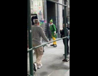 Man elf costume look at sunglasses on street