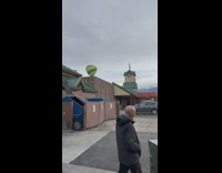 Green Hot Air Balloon fly in the air