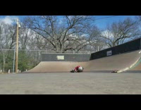 two angle red shirt kid jumps ramp and slams into quarterpipe