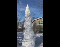 Guys build tall snowman using eight pt. 2 