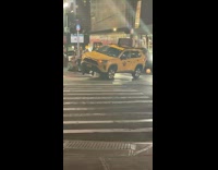 Taxi SUV drives over curb hazard lights