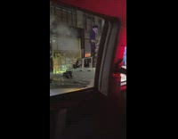 Parked truck with large menorah candle decoration 