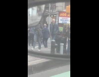 Collab WINY - Man spanks another man on the sidewalk