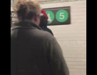two guys slide down subway escalators 