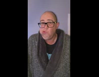 Guy shakes face in slow motion glasses 