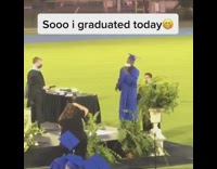 Blue graduation gown guy dances across stage