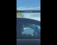 Girl inside of car on phone screaming