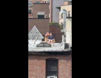 Collab winy - Man gives haircut to woman on rooftop 