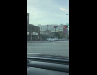 Two women cartwheel sidewalk across stoplight music
