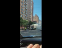 Smoke come out of garbage truck street