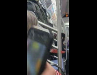 Man in scary costume stands still with machete