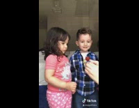 Two little kids ring pop resist eating it