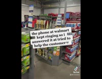Guy picks up customer call in walmart helps woman