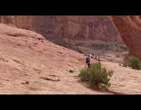 Girl shirtless tie hair stone arch conversation