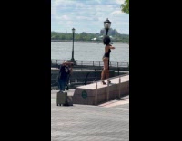 Woman in bikini and boots park photoshoot