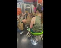 Girls sit on green circle stools in subway