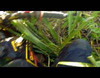 POV Guy on dirt bike with go-pro gets stuck in grass up hill