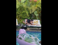 Woman drinks alcohol at the butt of another woman