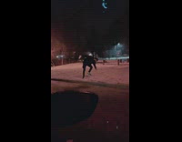 Guy slides across icy street on shoes 