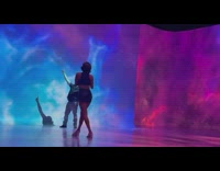 Man looks up and raise hands inside the art museum